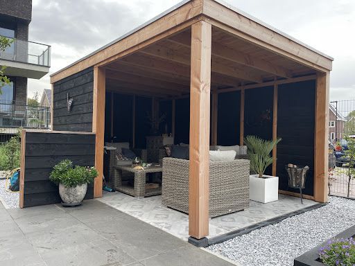 Design Tuinkamer in Zutphen: Platdak Overkapping met Glazen Schuifdeuren